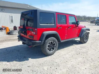 2015 Jeep Wrangler Unlimited Rubicon Hard Rock with VIN 1C4HJWFG9FL525556, listed as a IAAI auction lot 41973576 with 246,949 mi miles. Bid and sale history available at carsss.com. Image 4.