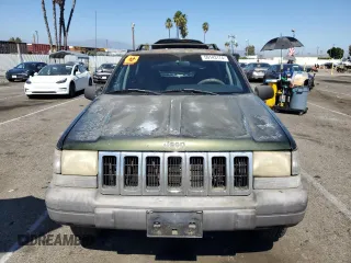 1996 Jeep Grand Cherokee Laredo with VIN 1J4FX58S1TC169501, listed as a Copart auction lot 59143174 with 0 mi miles and Salvage Title. Bid and sale history available at carsss.com. Image 5.