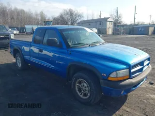 1999 Dodge Dakota SLT z VIN 1B7GL22X9XS221381, wystawiony jako IAAI lot #41934363 z przebiegiem 261 780 mil mil oraz . Historia ofert i sprzedaży dostępna na DreamBid. Obrazek 1.