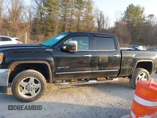 2015 GMC Sierra 2500HD available WiFi SLT with VIN 1GT12ZEG7FF606328, listed as a IAAI auction lot 41793799 with 94,107 mi miles. Bid and sale history available at carsss.com. Image 14.