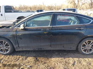 2020 Ford Fusion Hybrid Titanium with VIN 3FA6P0RU9LR141476, listed as a IAAI auction lot 41472921 with 84,433 mi miles. Bid and sale history available at carsss.com. Image 15.