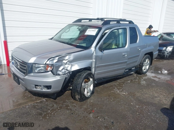 2014 Honda Ridgeline RTL with VIN 5FPYK1F51EB012843, listed as a IAAI auction lot 41629002 with 114,761 mi miles. Bid and sale history available at carsss.com. Image 2.