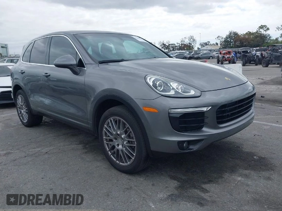 2016 Porsche Cayenne with VIN WP1AA2A27GKA15797, listed as a IAAI auction lot 42063043 with 81,464 mi miles. Bid and sale history available at carsss.com. Image 1.