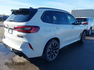 2022 BMW X5 M with VIN 5YMJU0C02N9K39077, listed as a IAAI auction lot 41711996 with 11,875 mi miles. Bid and sale history available at carsss.com. Image 4.