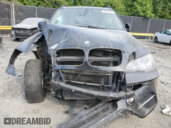 2012 BMW X5 35i with VIN 5UXZV4C5XCL761370, listed as a Copart auction lot 59436845 with 124,722 mi miles and Salvage title. Bid and sale history available at DreamBid. Image 5.