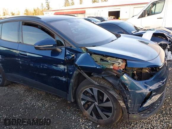 2023 Volkswagen ID.4 Pro z VIN 1V2DNPE81PC017620, wystawiony jako IAAI lot #41573053 z przebiegiem 15 462 mil mil oraz . Historia ofert i sprzedaży dostępna na DreamBid. Obrazek 6.