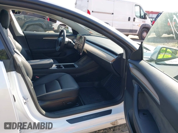 2023 Tesla Model 3 with VIN 5YJ3E1EA3PF617460, listed as a IAAI auction lot 42154401 with 9,578 mi miles and . Bid and sale history available at DreamBid. Image 5.