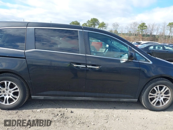 2011 Honda Odyssey EX with VIN 5FNRL5H4XBB011918, listed as a IAAI auction lot 42056043 with 201,821 mi miles and . Bid and sale history available at carsss.com. Image 13.