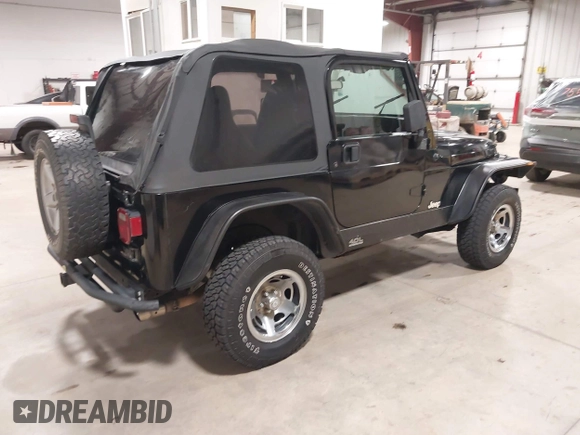 2002 Jeep Wrangler Sport with VIN 1J4FA49S02P704741, listed as a IAAI auction lot 41759558 with 191,126 mi miles. Bid and sale history available at carsss.com. Image 4.