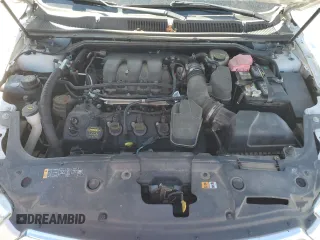 2013 Ford Taurus Limited z VIN 1FAHP2F8XDG202743, wystawiony jako Copart lot #48457145 z przebiegiem 161 331 mil mil oraz Szkoda całkowita • Salvage title. Historia ofert i sprzedaży dostępna na DreamBid. Obrazek 11.