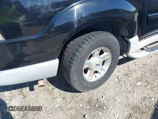 2003 Ford Explorer Sport Trac XLS z VIN 1FMZU77E23UB74361, wystawiony jako IAAI lot #42305659 z przebiegiem 193 291 mil mil oraz . Historia ofert i sprzedaży dostępna na DreamBid. Obrazek 11.