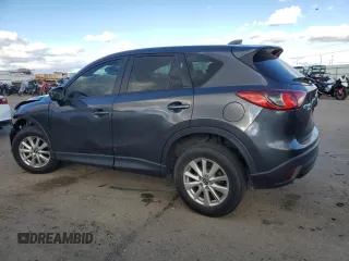 2015 Mazda CX-5 Sport with VIN JM3KE4BE0F0441203, listed as a Copart auction lot 79968514 with 134,890 mi miles and Salvage title. Bid and sale history available at DreamBid. Image 2.