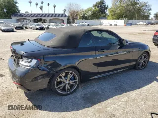 2015 BMW 2 Series M235i with VIN WBA1M1C56FV393730, listed as a Copart auction lot 45348734 with 59,231 mi miles and Salvage title. Bid and sale history available at DreamBid. Image 3.