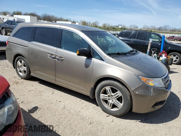 2011 Honda Odyssey Touring Elite with VIN 5FNRL5H9XBB030061, listed as a Copart auction lot 55067775 with 142,245 mi miles and Clean Title. Bid and sale history available at DreamBid. Image 4.