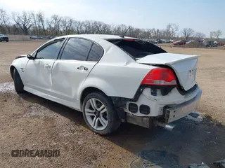 2009 Pontiac G8 with VIN 6G2ER57729L153123, listed as a IAAI auction lot 42046031 with 100,419 mi miles. Bid and sale history available at carsss.com. Image 3.