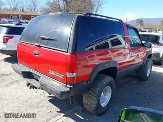 1999 Chevrolet Tahoe with VIN 3GNEK18R7XG189820, listed as a IAAI auction lot 41631906 with 212,720 mi miles. Bid and sale history available at carsss.com. Image 4.