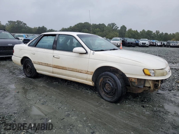 1994 Ford Taurus GL z VIN 1FALP52U5RA152732, wystawiony jako Copart lot #70472324 z przebiegiem 52 781 mil mil oraz Szkoda całkowita • Salvage title. Historia ofert i sprzedaży dostępna na DreamBid. Obrazek 4.