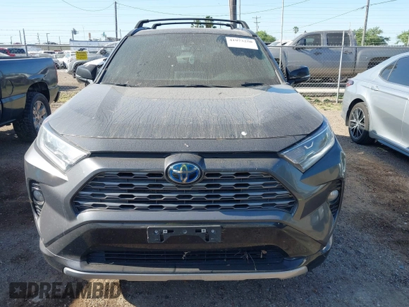 2021 Toyota RAV4 Hybrid XSE z VIN 2T3E6RFV8MW006805, wystawiony jako IAAI lot #41973250 z przebiegiem 77 483 mil mil oraz . Historia ofert i sprzedaży dostępna na DreamBid. Obrazek 12.