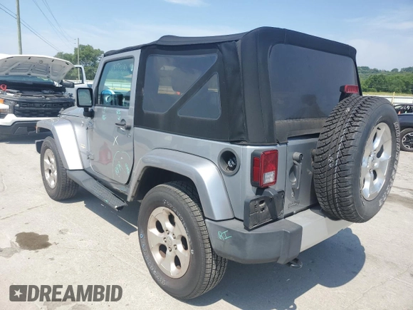 2015 Jeep Wrangler Sahara with VIN 1C4AJWBG1FL705900, listed as a Copart auction lot 62353275 with 64,866 mi miles and Salvage title. Bid and sale history available at DreamBid. Image 2.