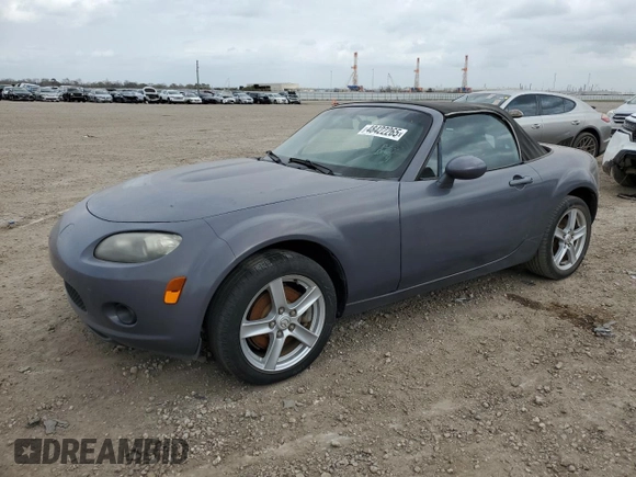 2007 Mazda MX-5 Miata Sport z VIN JM1NC25F970134960, wystawiony jako Copart lot #48422265 z przebiegiem 149 357 mil mil oraz Czysty tytuł • Clean title. Historia ofert i sprzedaży dostępna na DreamBid. Obrazek 1.