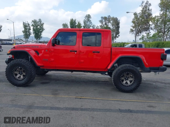 2021 Jeep Gladiator Rubicon with VIN 1C6JJTBGXML572976, listed as a IAAI auction lot 42134909 with 35,612 mi miles and . Bid and sale history available at DreamBid. Image 14.