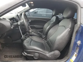 2014 MINI Coupe S z VIN WMWSX3C59ET772948, wystawiony jako Copart lot #81220834 z przebiegiem 99 211 mil mil oraz Szkody całkowita. Historia ofert i sprzedaży dostępna na DreamBid. Obrazek 7.