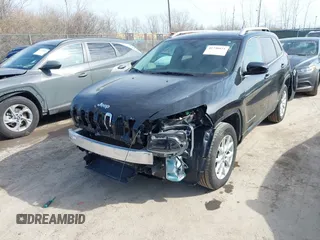2015 Jeep Cherokee North with VIN 1C4PJMCS4FW792918, listed as a IAAI auction lot 41748651 with 107,034 mi miles. Bid and sale history available at carsss.com. Image 6.