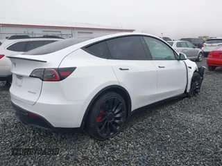 2023 Tesla Model Y Performance z VIN 7SAYGDEF2PF917295, wystawiony jako IAAI lot #41260852 z przebiegiem 23 295 mil mil oraz . Historia ofert i sprzedaży dostępna na DreamBid. Obrazek 4.