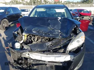 2014 Mazda 5 Sport with VIN JM1CW2BL1E0163682, listed as a IAAI auction lot 41344215 with 63,811 mi miles and . Bid and sale history available at carsss.com. Image 12.