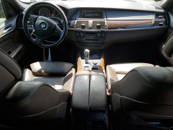 2012 BMW X5 35i with VIN 5UXZV4C54CL744502, listed as a Copart auction lot 57828115 with 161,597 mi miles and Clean title. Bid and sale history available at DreamBid. Image 8.