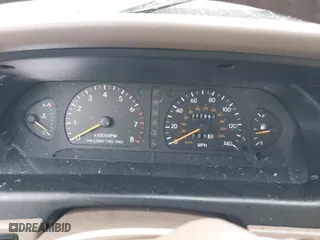 1997 Toyota Avalon XL with VIN 4T1BF12B1VU198756, listed as a IAAI auction lot 41613887 with 217,863 mi miles. Bid and sale history available at carsss.com. Image 7.