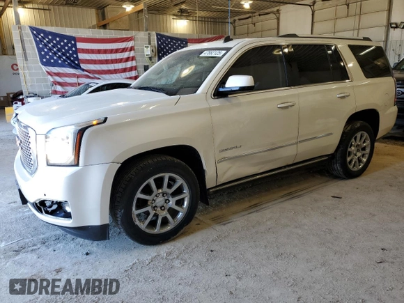 2015 GMC Yukon Denali with VIN 1GKS2CKJ7FR266750, listed as a Copart auction lot 47882125 with 121,705 mi miles and Salvage Title. Bid and sale history available at carsss.com. Image 1.