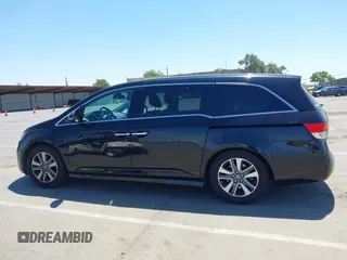 2014 Honda Odyssey Touring with VIN 5FNRL5H99EB133864, listed as a IAAI auction lot 42201359 with 122,490 mi miles and . Bid and sale history available at DreamBid. Image 14.