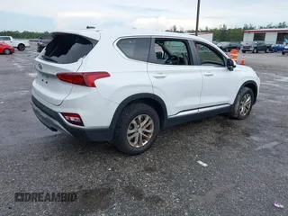 2019 Hyundai Santa Fe SE with VIN 5NMS23ADXKH038506, listed as a IAAI auction lot 42407399 with 54,540 mi miles and . Bid and sale history available at DreamBid. Image 4.