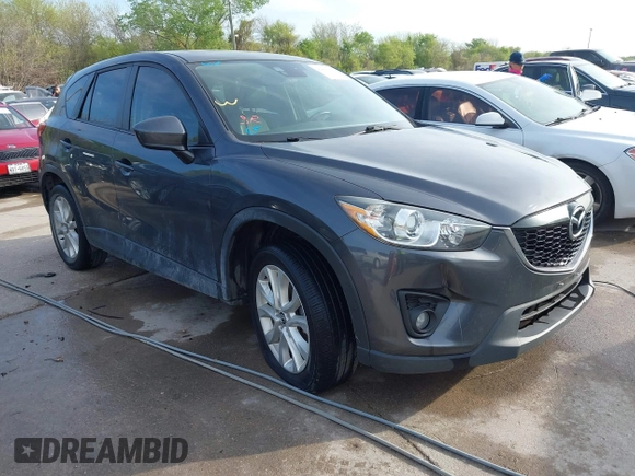 2014 Mazda CX-5 Grand Touring with VIN JM3KE2DY7E0345742, listed as a IAAI auction lot 41864116 with 158,746 mi miles. Bid and sale history available at carsss.com. Image 1.