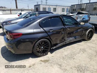 2018 BMW 5 Series 530e with VIN WBAJA9C55JG623181, listed as a Copart auction lot 61593983 with 63,577 mi miles and . Bid and sale history available at DreamBid. Image 3.