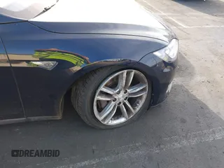 2014 Tesla Model S 60 z VIN 5YJSA1H11EFP30596, wystawiony jako IAAI lot #42235901 z przebiegiem 143 837 mil mil oraz . Historia ofert i sprzedaży dostępna na DreamBid. Obrazek 22.