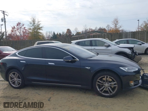 2014 Tesla Model S 60 with VIN 5YJSA1S12EFP42605, listed as a IAAI auction lot 40905031 with 68,155 mi miles and . Bid and sale history available at DreamBid. Image 13.
