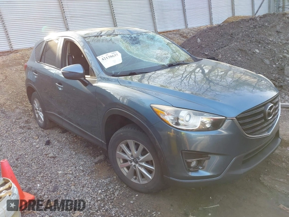 2016 Mazda CX-5 Touring with VIN JM3KE4CY5G0771252, listed as a IAAI auction lot 42138637 with 106,767 mi miles and . Bid and sale history available at carsss.com. Image 1.