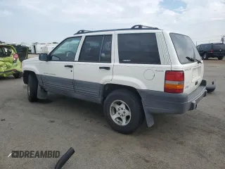 1997 Jeep Grand Cherokee Laredo with VIN 1J4GZ58S2VC676652, listed as a Copart auction lot 64939974 with 256,923 mi miles and Salvage Title. Bid and sale history available at carsss.com. Image 2.