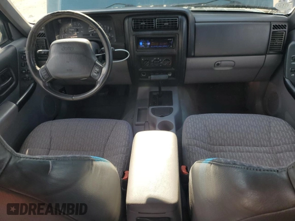 1997 Jeep Cherokee Sport with VIN 1J4FT68S4VL545385, listed as a Copart auction lot 49616325 with 239,798 mi miles and Salvage Title. Bid and sale history available at carsss.com. Image 8.