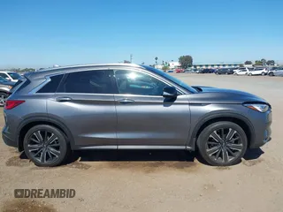 2021 Infiniti QX50 Luxe z VIN 3PCAJ5BA2MF111323, wystawiony jako IAAI lot #42218711 z przebiegiem 27 864 mil mil oraz . Historia ofert i sprzedaży dostępna na DreamBid. Obrazek 13.