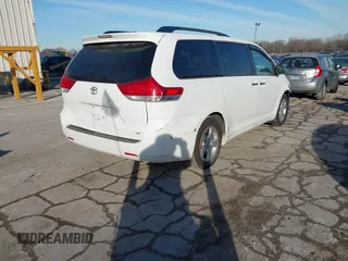 2014 Toyota Sienna LE AAS with VIN 5TDKK3DC2ES483679, listed as a IAAI auction lot 41547261 with 142,697 mi miles. Bid and sale history available at carsss.com. Image 4.