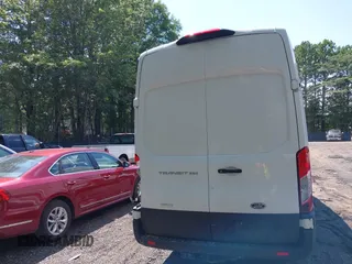 2022 Ford Transit Cargo z VIN 1FTBR3XG4NKA04700, wystawiony jako IAAI lot #42753263 z przebiegiem 80 467 mil mil oraz . Historia ofert i sprzedaży dostępna na DreamBid. Obrazek 16.