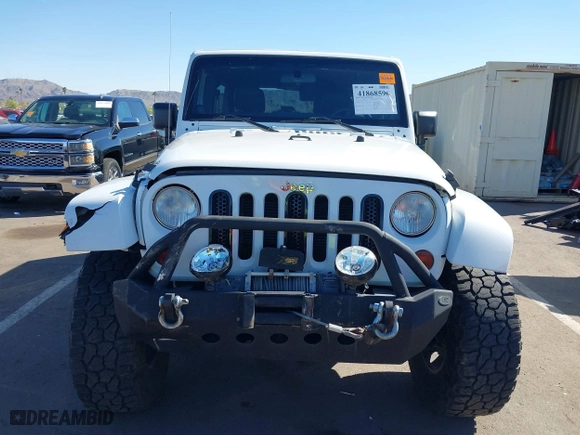 2012 Jeep Wrangler Unlimited Sahara with VIN 1C4BJWEG2CL117080, listed as a IAAI auction lot 41868590 with 92,475 mi miles. Bid and sale history available at carsss.com. Image 12.