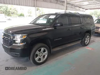 2015 Chevrolet Suburban LT with VIN 1GNSKJKC7FR199544, listed as a IAAI auction lot 42169017 with 219,219 mi miles and . Bid and sale history available at DreamBid. Image 2.