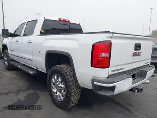 2015 GMC Sierra 2500HD Denali with VIN 1GT120E85FF681680, listed as a IAAI auction lot 42081711 with 67,676 mi miles and . Bid and sale history available at DreamBid. Image 3.