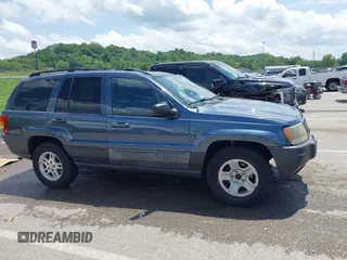 2004 Jeep Grand Cherokee Laredo with VIN 1J4GX48S44C205469, listed as a IAAI auction lot 42310571 with 154,929 mi miles and . Bid and sale history available at DreamBid. Image 13.