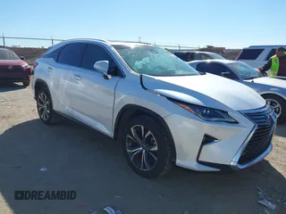 2018 Lexus RX 350 z VIN 2T2ZZMCAXJC106256, wystawiony jako IAAI lot #41658817 z przebiegiem 103 733 mil mil oraz . Historia ofert i sprzedaży dostępna na DreamBid. Obrazek 1.