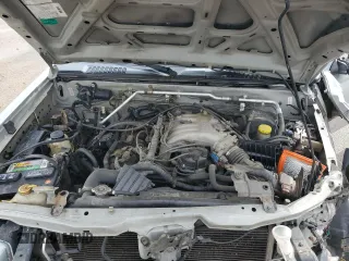 2002 Nissan Frontier SE with VIN 1N6ED27T92C379360, listed as a Copart auction lot 51235495 with 230,598 mi miles and Salvage title. Bid and sale history available at DreamBid. Image 11.